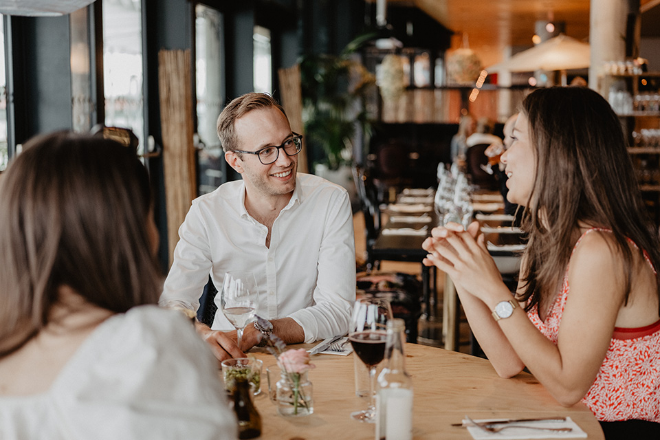 People enjoying conversation a local restaurant.