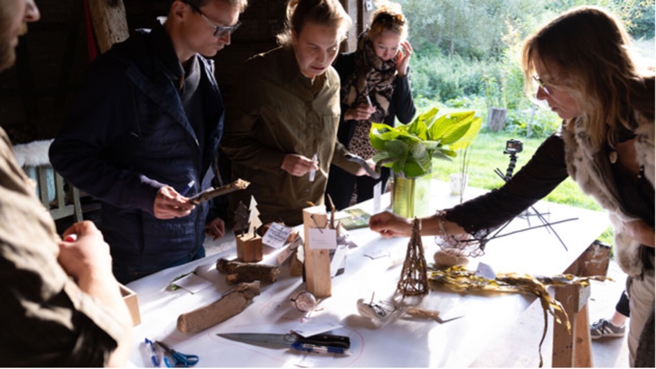 Creating a forest-based library of forage-able foods. Stakeholders using tangibles collected from a barn in the forest to conduct a stakeholder mapping exercise. The library-to-be is situated in Stenderup Midtskov, in Kolding, Denmark, and is part of the Fusilli project. Image: Danielle Wilde