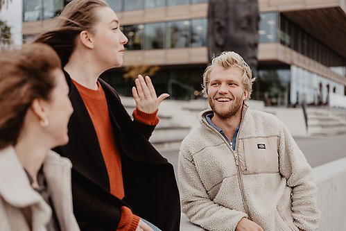 People talking on Umeå arts campus