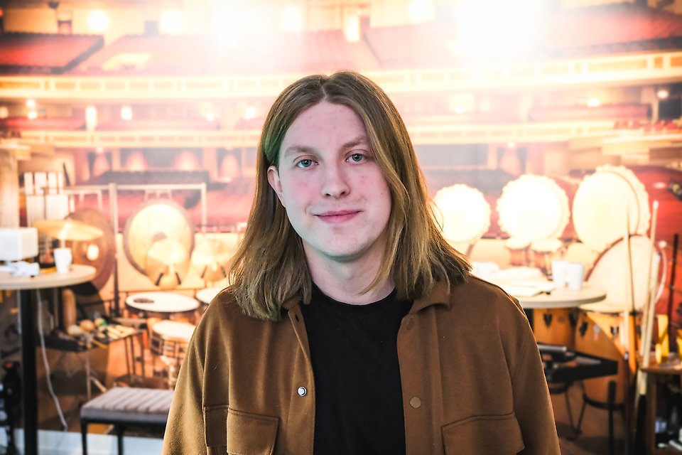 Filip Wikström in front of a drum set