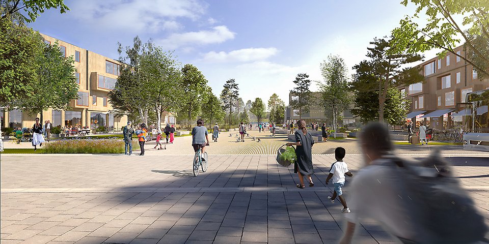 Bilden visar torget med öppna ytor, skolan i bakgrunden. Rakt fram ligger Nydalasjön.